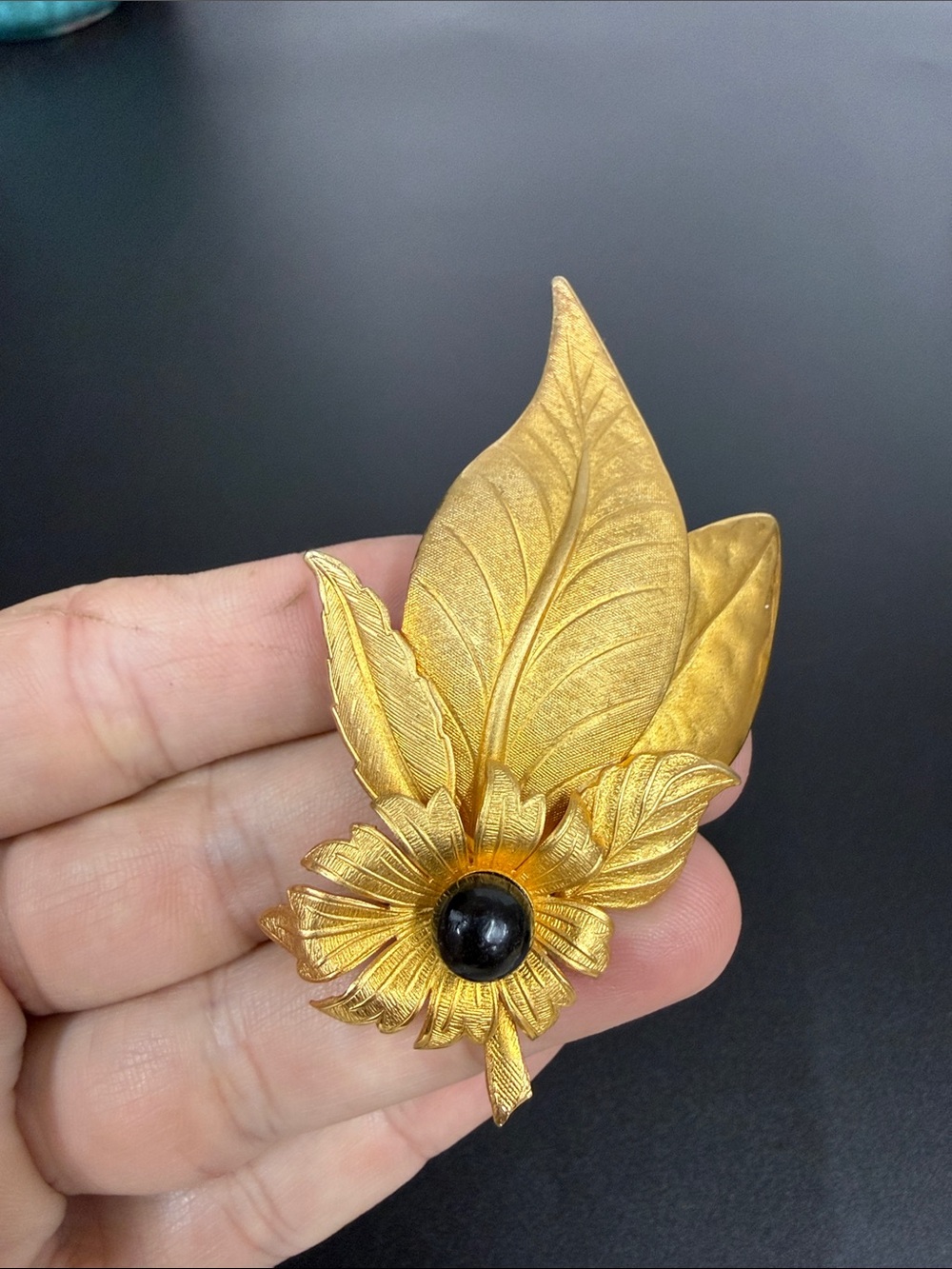 Gold-Tone Floral Leaf Brooch with Black Center Stone